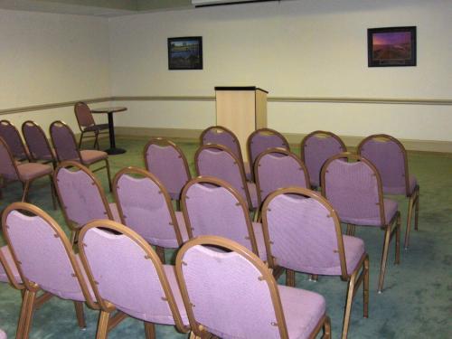 a row of chairs in a room with purple chairs at Extended Stay America Suites - Atlanta - Gwinnett Place in Duluth
