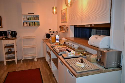 a kitchen with a counter top with a microwave at Solsta Hotell in Karlstad