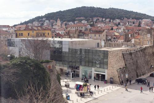 a group of people walking in front of a city at PRIMA Life Spalato in Split