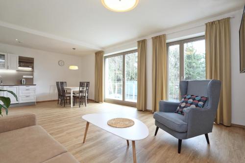 a living room with a couch and a table at Apartmány Terasy Café in Liberec