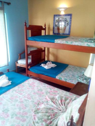 Ένα ή περισσότερα κρεβάτια σε δωμάτιο στο Hotel Villa Paz