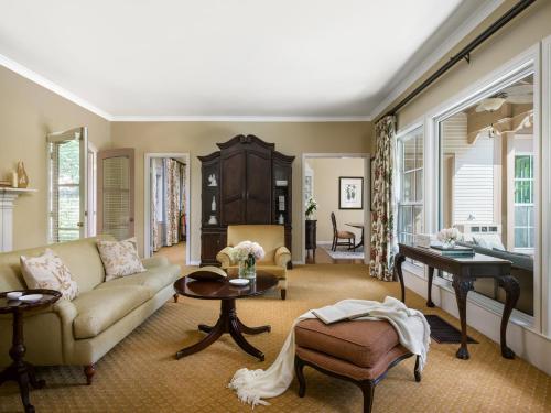 a living room with a couch and a table at The Langham Huntington, Pasadena in Pasadena