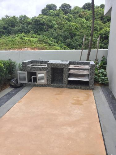 a balcony with a sink on the side of a building at Meridin Medini Muslim Condo in Nusajaya