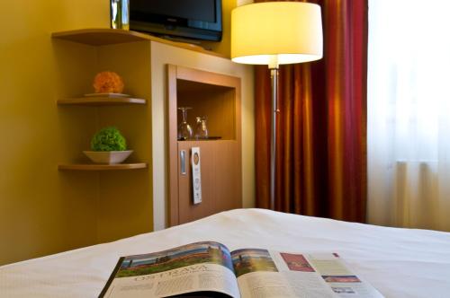 Säng eller sängar i ett rum på Imperial Hotel Ostrava