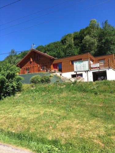 a house on the side of a hill at chalet vosgien in Le Ménil
