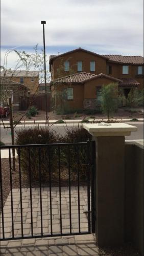 an iron gate in front of a house at Queen creek az casita in Queen Creek