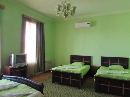 Postel nebo postele na pokoji v ubytování Guest House Nona