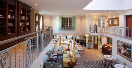 a living room filled with lots of furniture at Hermanus Boutique Guest House in Hermanus