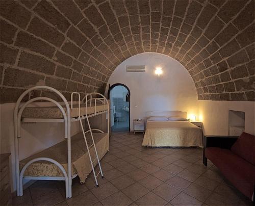 Llit o llits en una habitació de Hotel Masseria Le Pajare