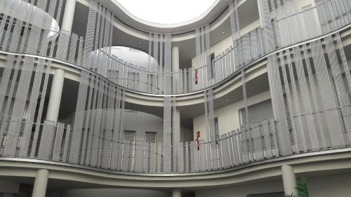 a view of a building with a spiral staircase at BONITO APARTAMENTO a 200 metros del centro de Sevilla con piscina y parking gratis in Seville