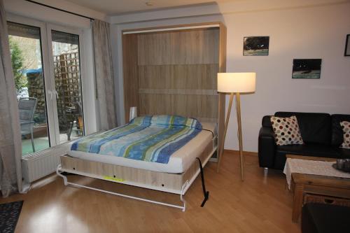 Tempat tidur dalam kamar di Ferienwohnung Sayn bei Koblenz