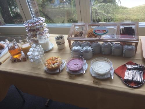 a table with a bunch of food on it at Hotel Restaurant Heidihof in Maienfeld