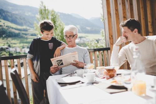 a group of people standing around a table at Arabella Retreat & Spa in Nauders