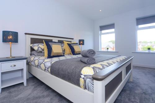 a bedroom with a bed with a teddy bear on it at Sandbanks Road in Poole