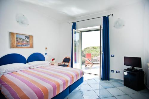 Postel nebo postele na pokoji v ubytování Hotel Villa Iulia