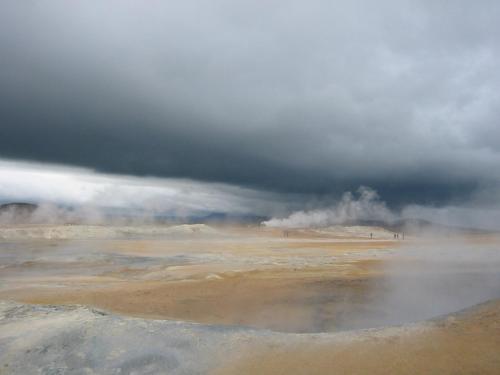 a stormy sky with a hot spring in the desert at Birkilauf in Myvatn