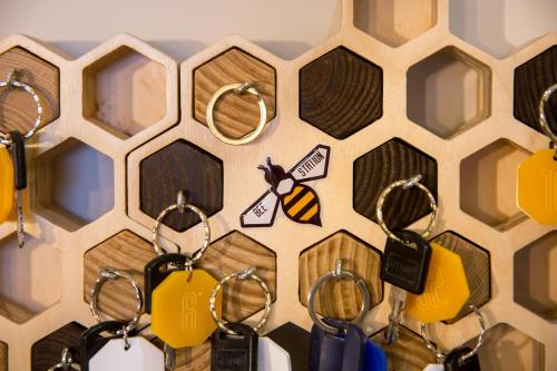 a bunch of key chains hanging on a wall at HOTEL Bee Station in Kyiv
