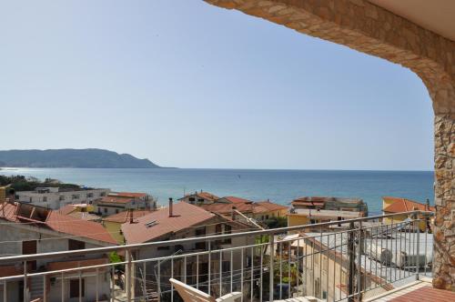 a view of the ocean from a balcony at Villa Dei Tigrotti in Santa Maria di Castellabate