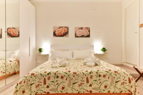 Postelja oz. postelje v sobi nastanitve BMGA l Coliseum Rome Apartment 1Bdr for Couples