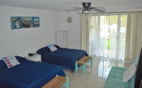 Postel nebo postele na pokoji v ubytování Preciosos Estudio Vista al Mar o jardín