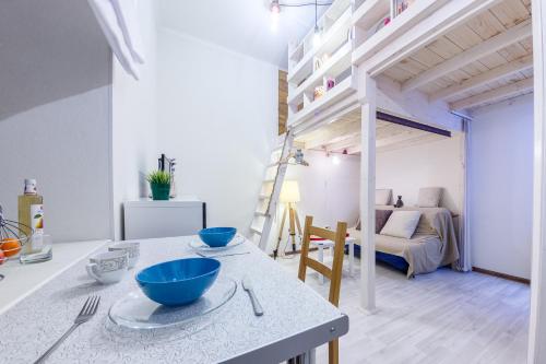 a kitchen and living room with a loft bed at Heart of the City Townhouse in Saint Petersburg
