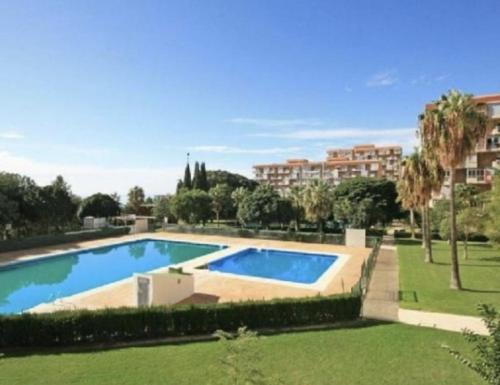 an image of a swimming pool in a yard at Honeymoon Apartments in Benalmádena