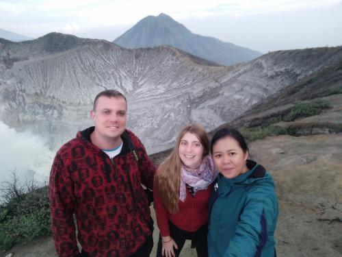 a group of people standing on top of a mountain at Homestay Lidiya in Banyuwangi