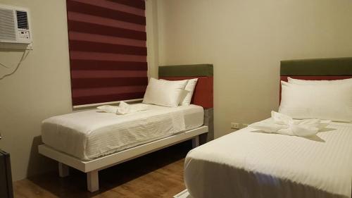 Postel nebo postele na pokoji v ubytování Propicio Hotel and Resort