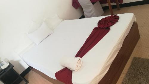 Postel nebo postele na pokoji v ubytování Friends Paradise