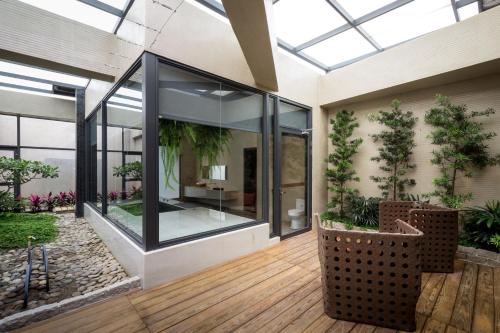 a glass extension of a house with a patio at Shu Jia Motel in Taichung