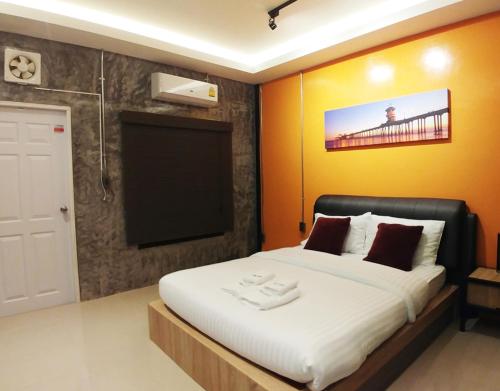 מיטה או מיטות בחדר ב-GREEN HOUSE Neo-Resotel