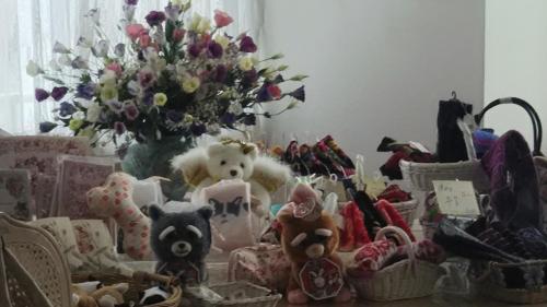 a bunch of stuffed animals and a vase with flowers at Akakura Hotel in Myoko