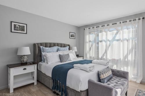 a bedroom with a large bed and a window at Harrison Grove in Forcett