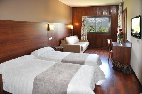 מיטה או מיטות בחדר ב-Castel de Vergio