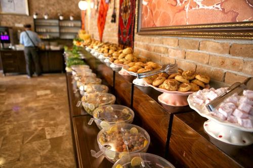 a table filled with lots of different types of pastries at Venus Hotel in Pamukkale