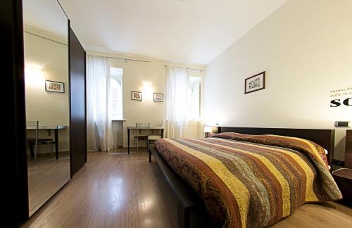 En eller flere senge i et værelse på B&B Piazza Del Popolo