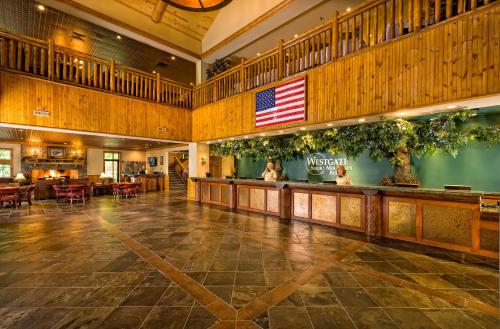 an empty lobby with an american flag on the wall at Westgate Smoky Mountain Resort & Spa in Gatlinburg