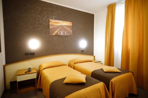 מיטה או מיטות בחדר ב-Hotel Giardinetto Al Sant'Orsola