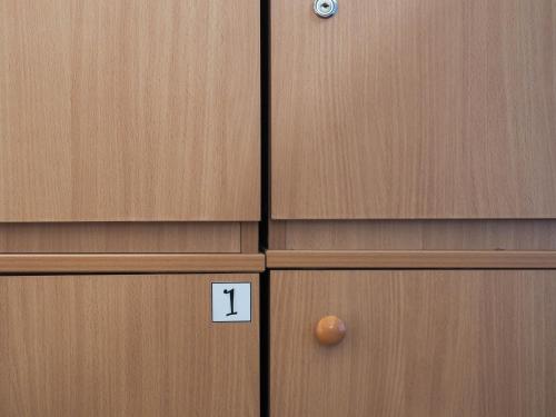 a pair of wooden doors with the number one on them at Hostel El Diablo in Belgrade