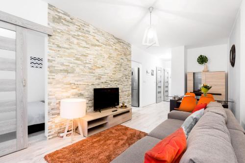 TV a/nebo společenská místnost v ubytování WrocApartments StarCenter - Parking Free