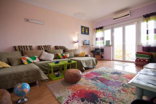 a living room with a couch and a rug at Backpackers Fairytale Hostel in Split