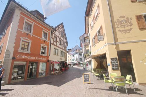 a city street with buildings and tables and chairs at Wohlfühlhotel Bercher in Waldshut-Tiengen