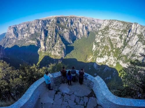 a group of people standing on top of a mountain at Gaia Guesthouse in Dilofo