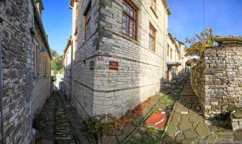an alley in an old stone building at Gaia Guesthouse in Dilofo