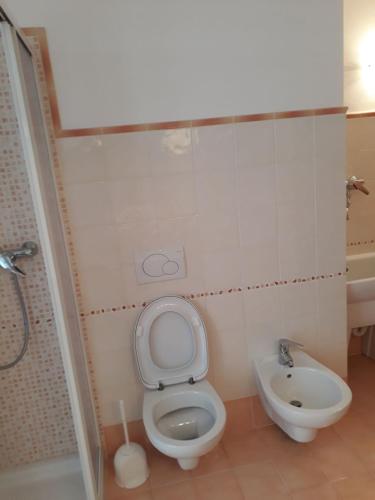 a bathroom with a toilet and a sink at HartlHof in Proves