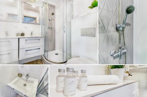 a white bathroom with a shower and a sink at Apartamenty Novomiejska 17 in Lublin
