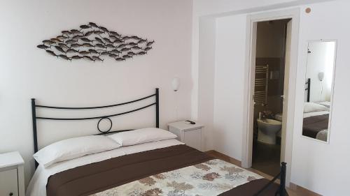 Ένα ή περισσότερα κρεβάτια σε δωμάτιο στο PalermiT'Amo