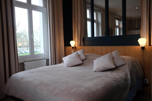 เตียงในห้องที่ Appartement Saint Malo-Rocabey