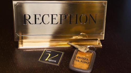 a metal container with a key and the words respiration at hotel Vajont in Vaiont