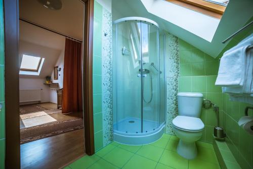 a bathroom with a toilet and a glass shower at Prague Sweet Home in Prague